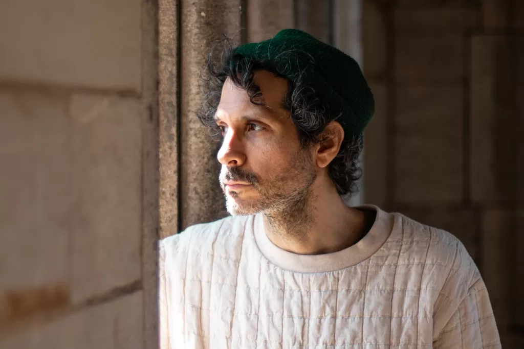 WHY?’s 'The Well I Fell Into': Beautiful Melancholia 2 'The Well I Fell Into' promo photo by Jacquelyn Johnson, Yoni Wolf looking out a window