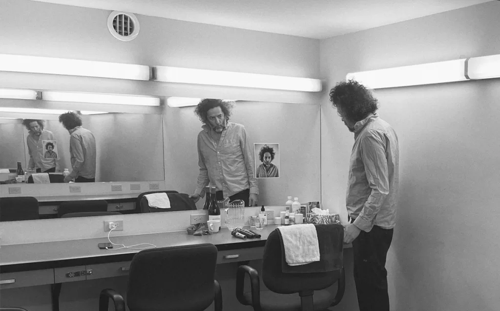 Weekend Videos: Destroyer - Bologna 1 Destroyer Press Photo for Dan's Boogie. Dan Bejar in black and white in what looks like a changing room.